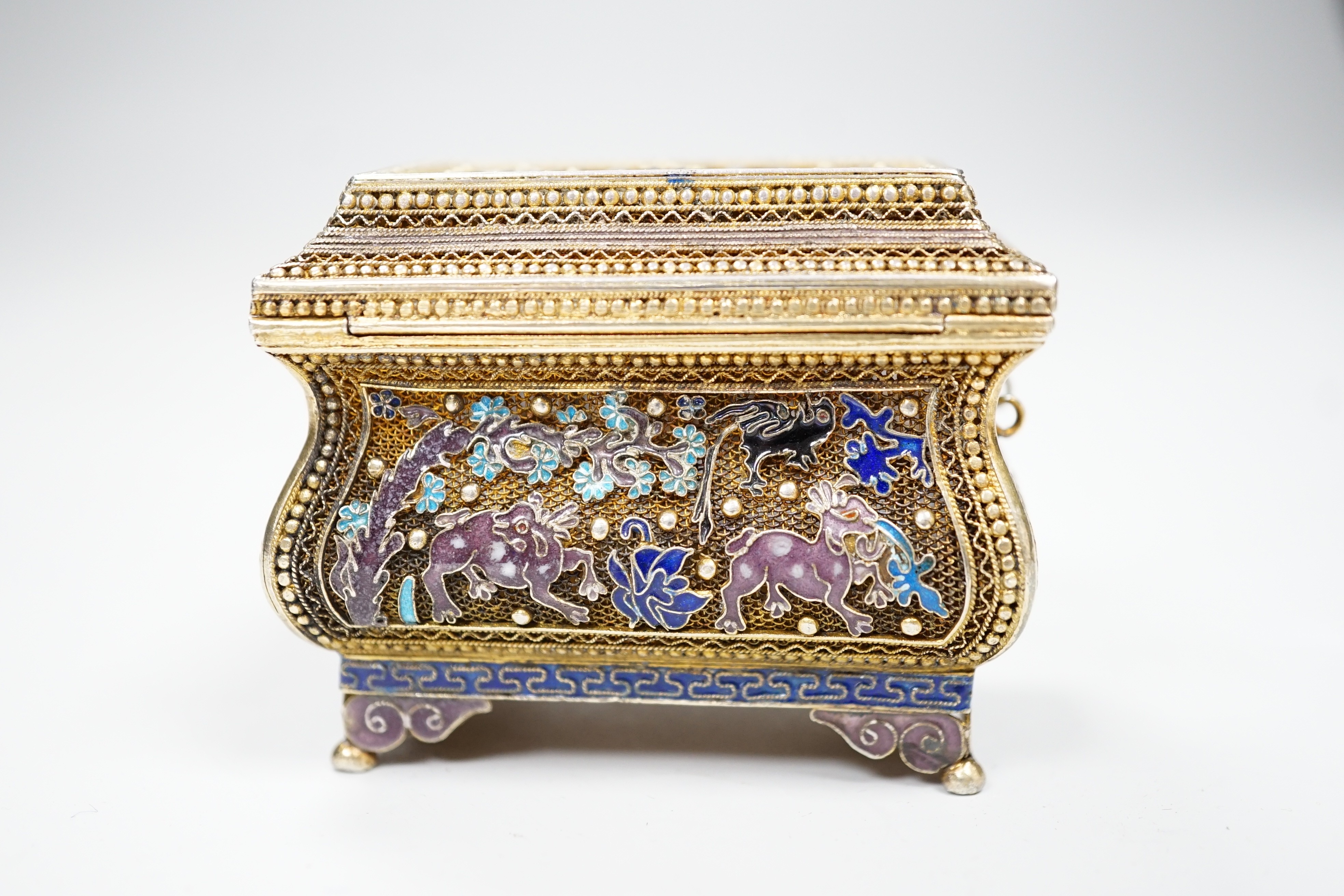 A Chinese gilded filigree white metal and enamelled trinket box, stamped 'silver', width 63mm, gross weight 76 grams.